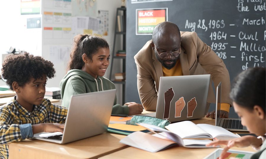 school-children-working-with-teacher-in-team-2025-03-18-22-23-30-utc